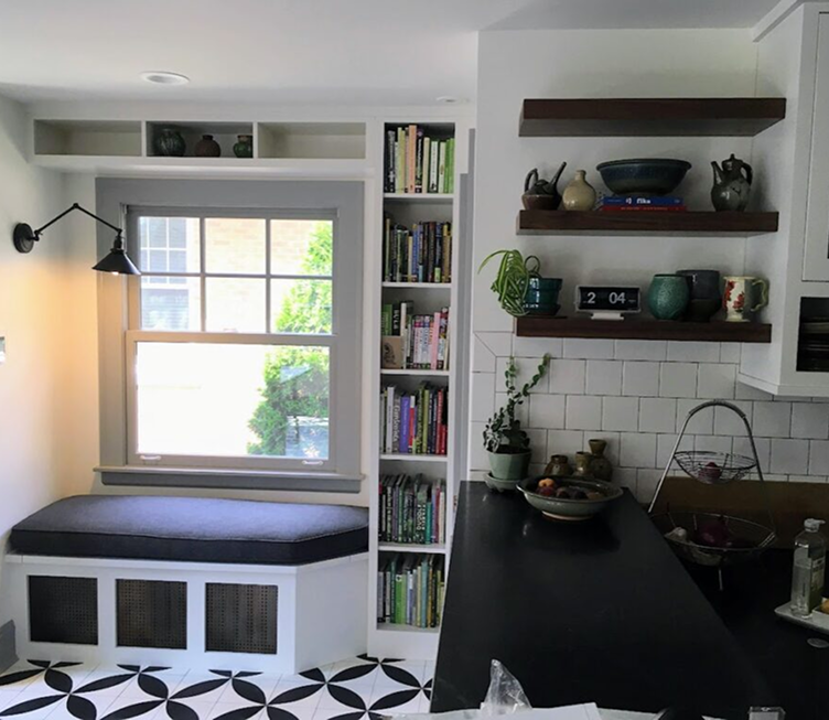 Finished kitchen remodeling project with window bench and shelving